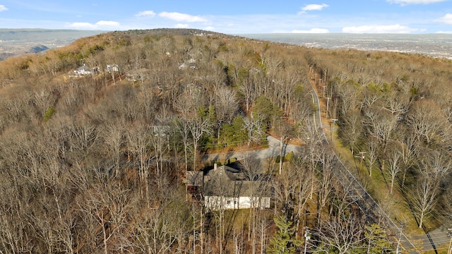 birds eye view of property with a view of trees