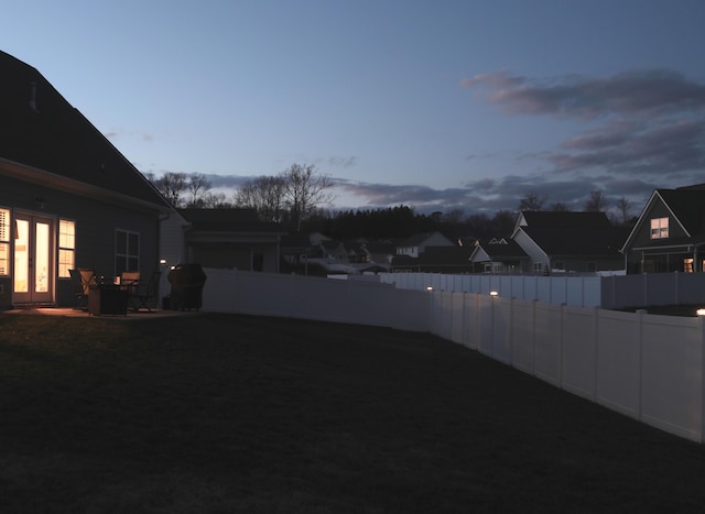 view of yard at dusk