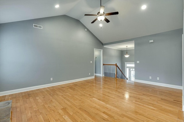 unfurnished living room with ceiling fan, high vaulted ceiling, and light hardwood / wood-style floors