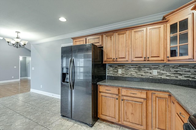 kitchen with stainless steel fridge with ice dispenser, crown molding, a chandelier, and backsplash