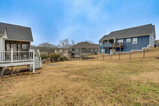 view of yard with a deck and a sunroom