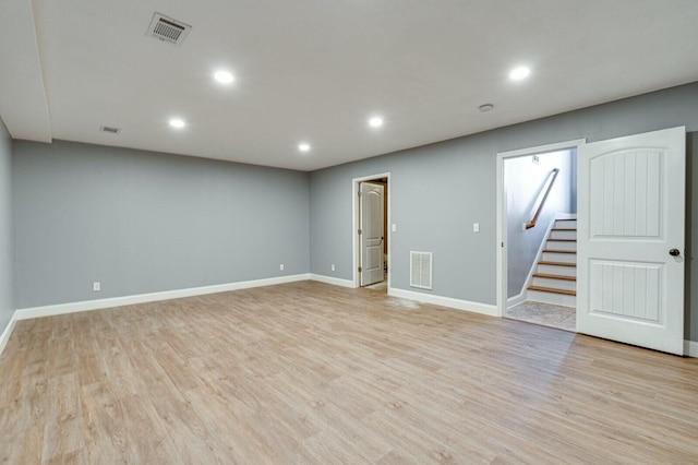 basement featuring light wood-type flooring