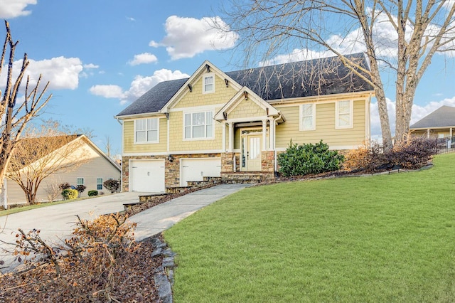 bi-level home featuring driveway, a front lawn, an attached garage, and stone siding