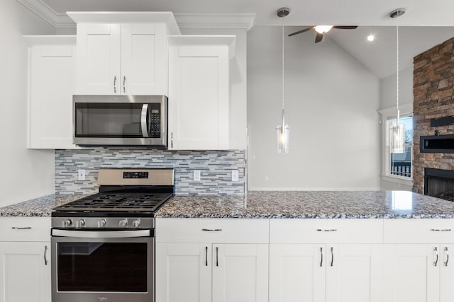 kitchen featuring white cabinetry, pendant lighting, and stainless steel appliances