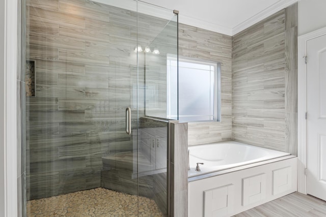 bathroom featuring shower with separate bathtub and crown molding