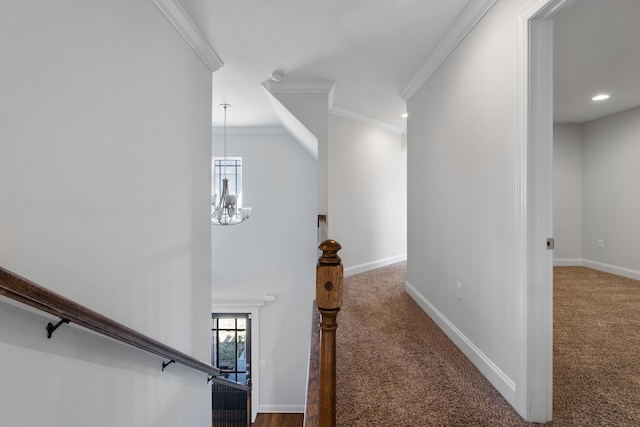 interior space with a notable chandelier, ornamental molding, and carpet floors