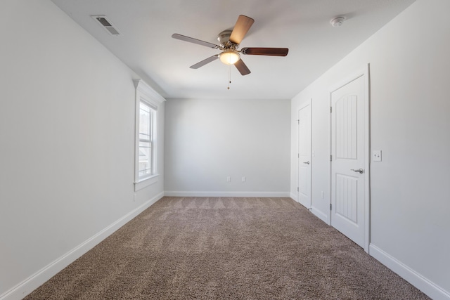 unfurnished bedroom featuring carpet floors and ceiling fan