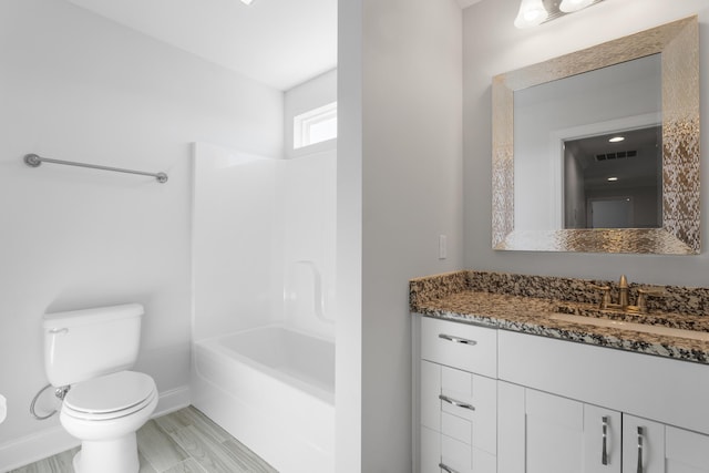 full bathroom featuring hardwood / wood-style flooring, shower / bathing tub combination, vanity, and toilet