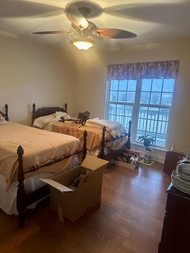 bedroom featuring ceiling fan and dark hardwood / wood-style flooring