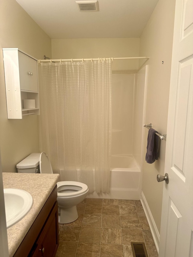 full bathroom featuring vanity, toilet, and shower / tub combo with curtain