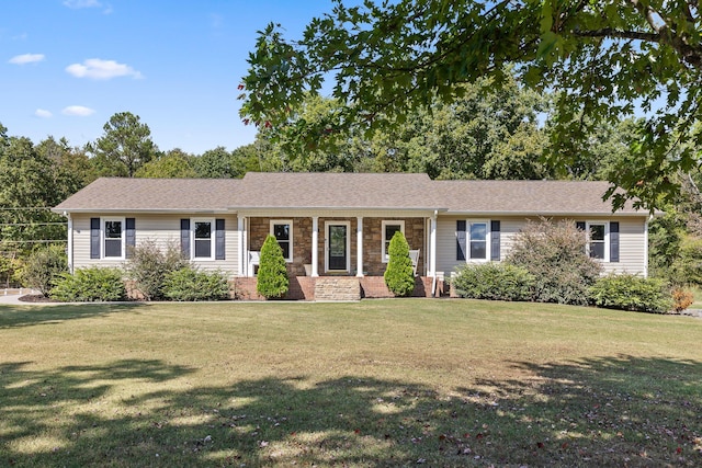 ranch-style house with covered porch and a front lawn