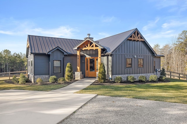 modern farmhouse with a front lawn