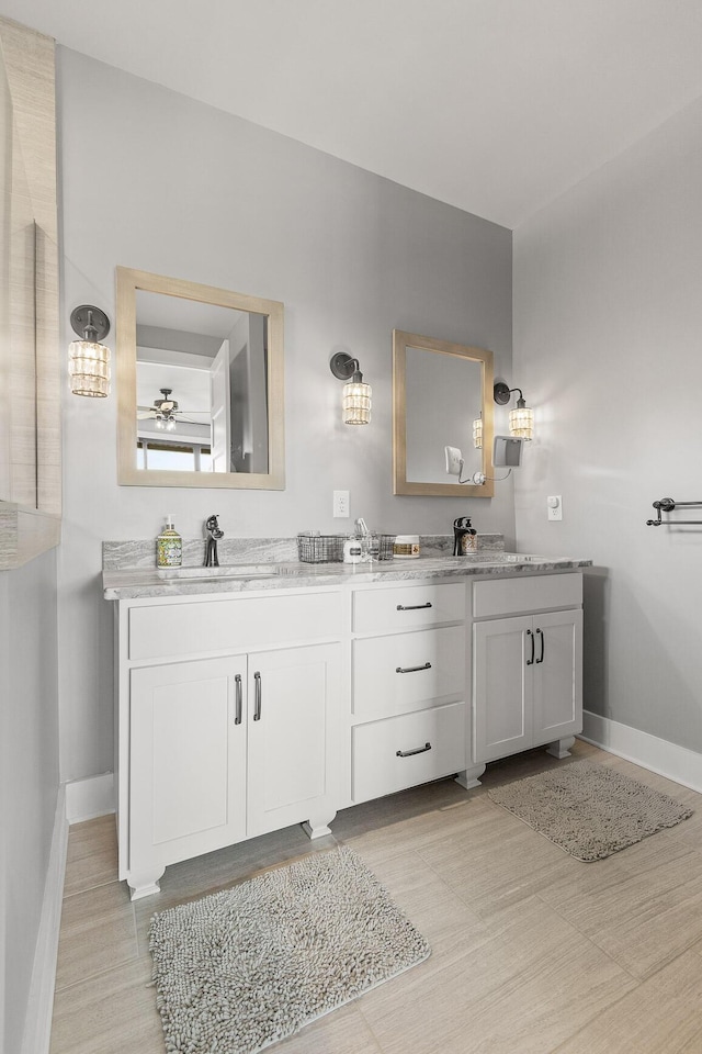 bathroom featuring ceiling fan and vanity