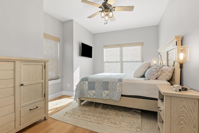 bedroom featuring ceiling fan and light hardwood / wood-style floors