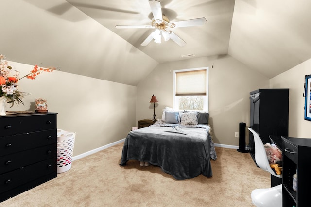 bedroom featuring ceiling fan, lofted ceiling, and light colored carpet