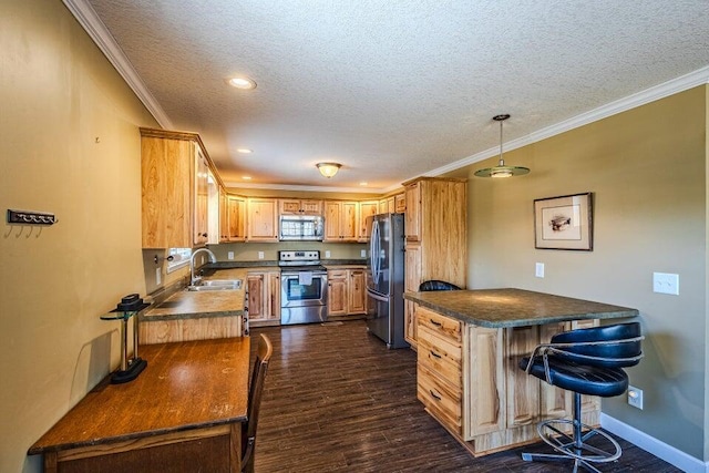 kitchen with crown molding, appliances with stainless steel finishes, sink, and a textured ceiling