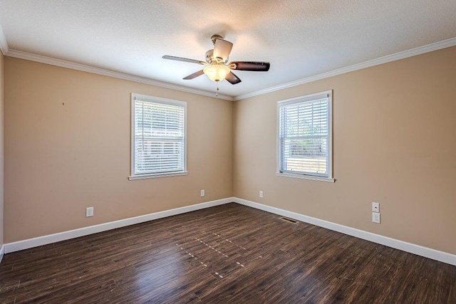 empty room with dark hardwood / wood-style flooring, ornamental molding, and ceiling fan