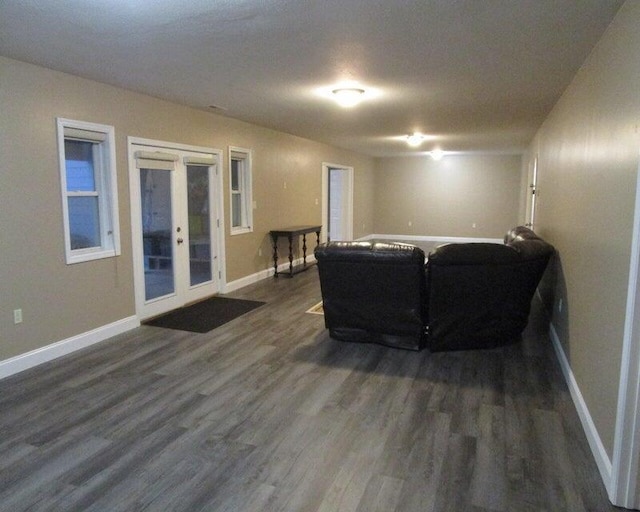 living room featuring dark hardwood / wood-style flooring and french doors