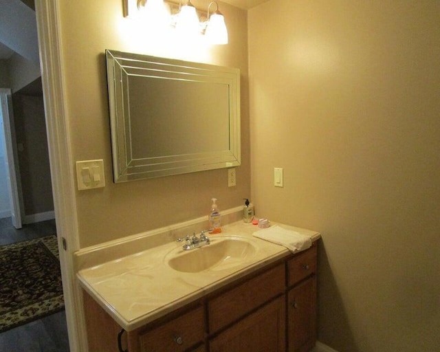 bathroom featuring vanity and a notable chandelier