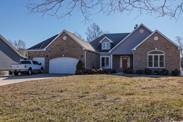 view of front property featuring a garage and a front lawn