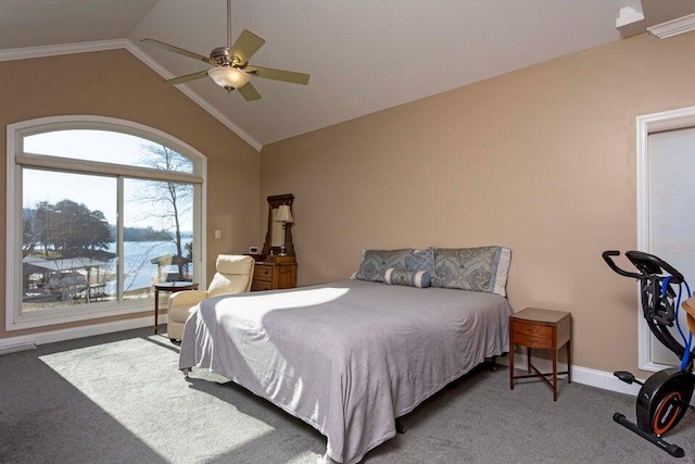 carpeted bedroom with lofted ceiling, ornamental molding, and ceiling fan