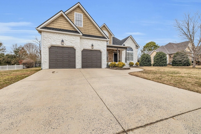 view of front of home featuring a garage and a front yard