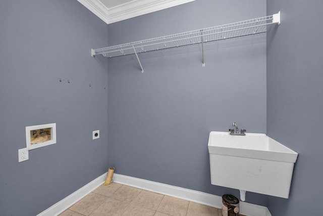 washroom with sink, ornamental molding, washer hookup, light tile patterned floors, and electric dryer hookup