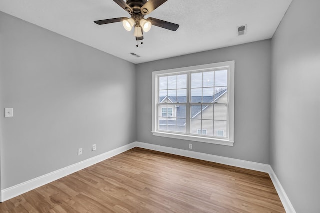 unfurnished room with ceiling fan and light hardwood / wood-style flooring