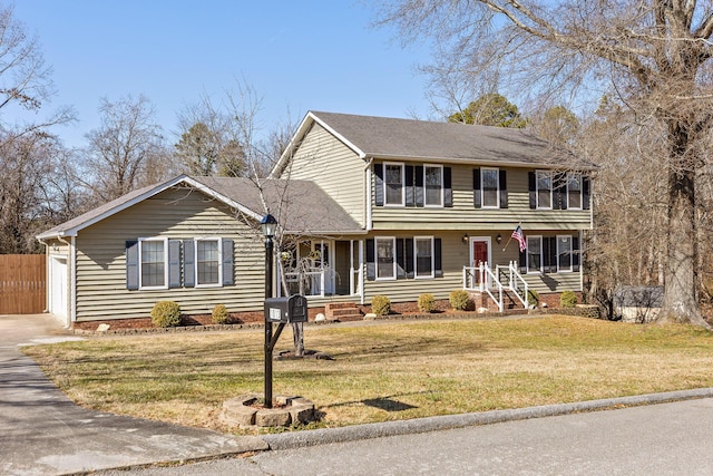 colonial home featuring a front lawn