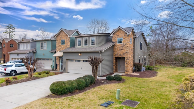 view of front of property with a garage and a front yard