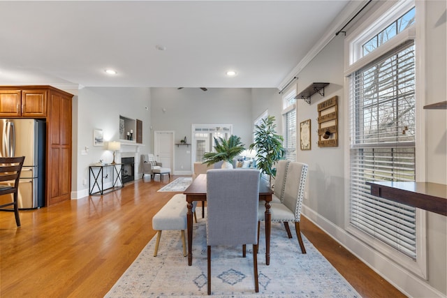 dining space with light hardwood / wood-style flooring and a wealth of natural light