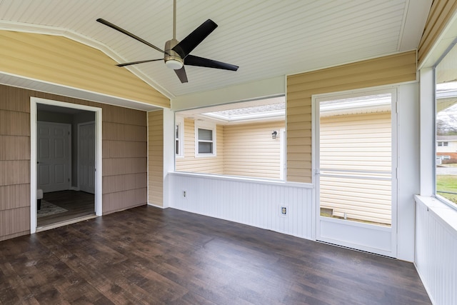 unfurnished sunroom featuring lofted ceiling and a ceiling fan