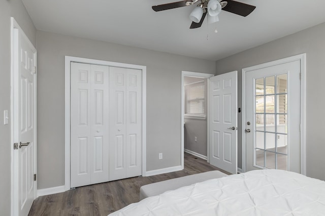 bedroom featuring a closet, ceiling fan, baseboards, and wood finished floors