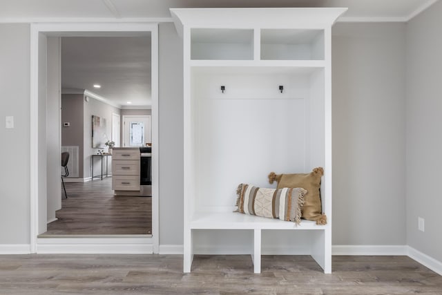 mudroom featuring crown molding, recessed lighting, wood finished floors, and baseboards