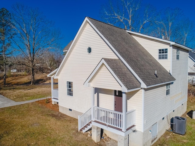 exterior space with a yard and central AC unit