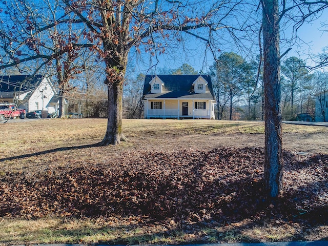 exterior space with a front yard and covered porch