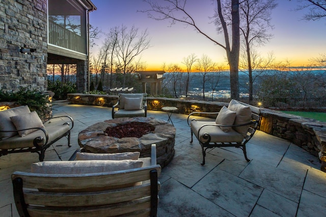 patio terrace at dusk with a fire pit