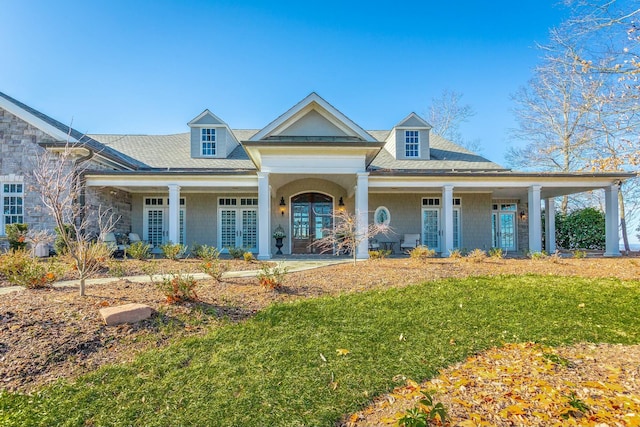 view of front of home featuring a front yard and french doors