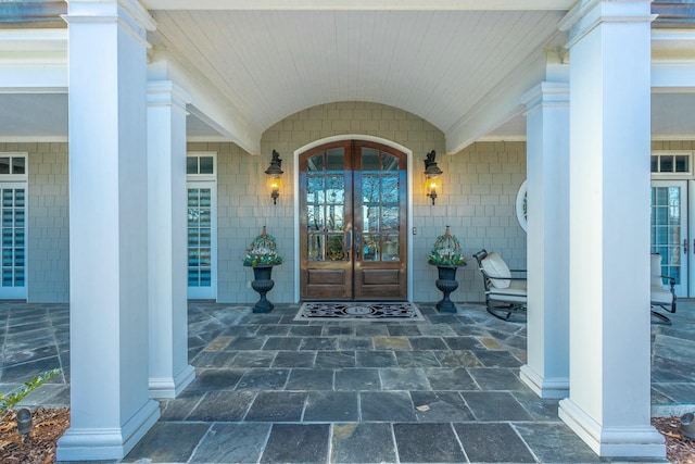 view of exterior entry featuring french doors