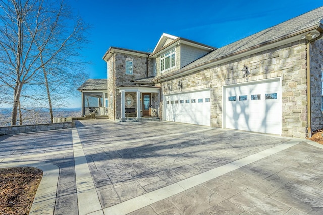 view of front of home featuring a garage and covered porch