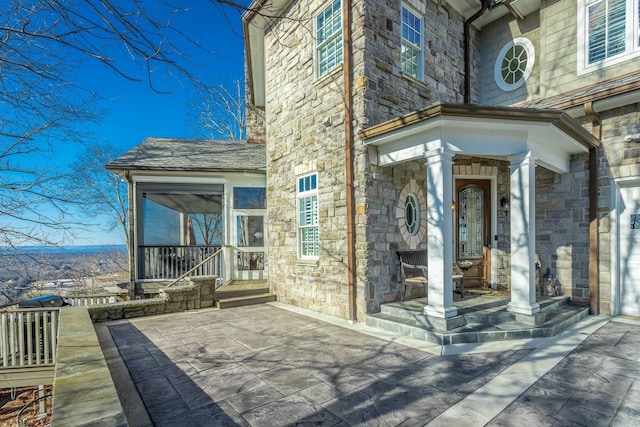 property entrance with a patio