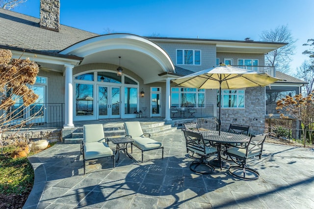 back of house featuring a patio and french doors