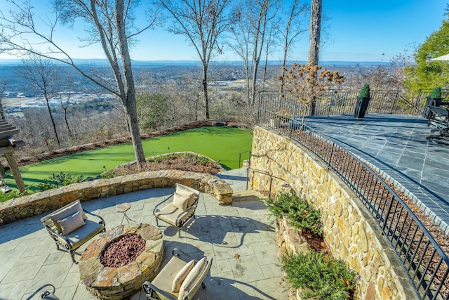 view of patio / terrace with an outdoor fire pit