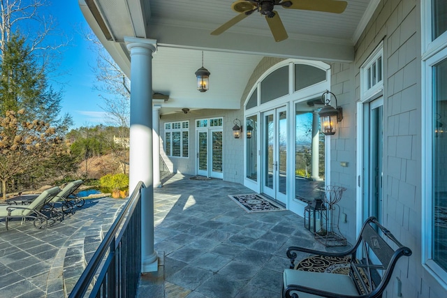 view of patio / terrace featuring ceiling fan and french doors