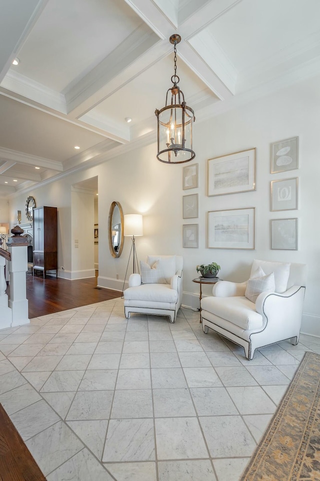 unfurnished room featuring coffered ceiling, beam ceiling, ornamental molding, and a chandelier