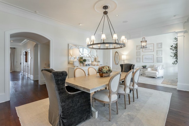 dining area featuring crown molding and dark hardwood / wood-style floors