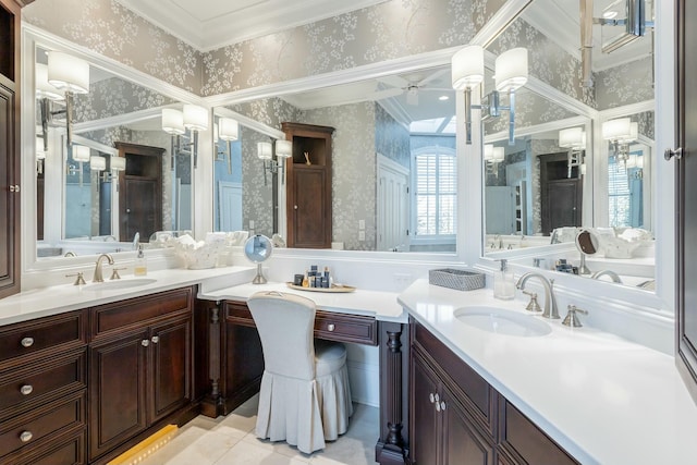 bathroom featuring tile patterned flooring, vanity, ornamental molding, and ceiling fan