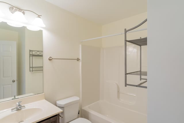 full bathroom with vanity, tub / shower combination, and toilet