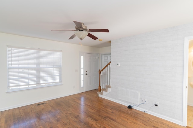 foyer entrance featuring ceiling fan and wood-type flooring