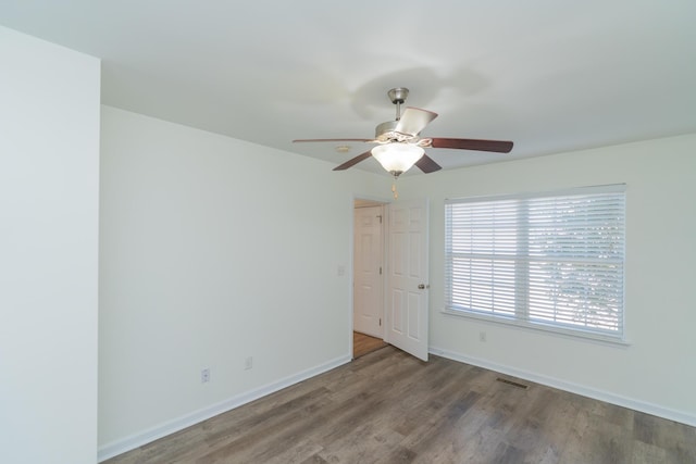 spare room with ceiling fan and hardwood / wood-style floors